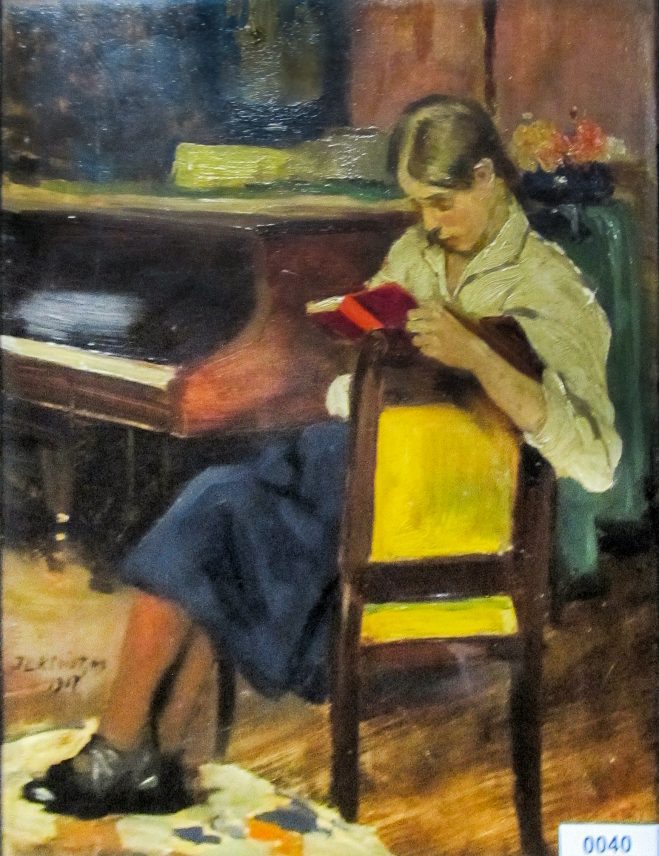 Pauline Schoel leest een boek bij de piano (1917)